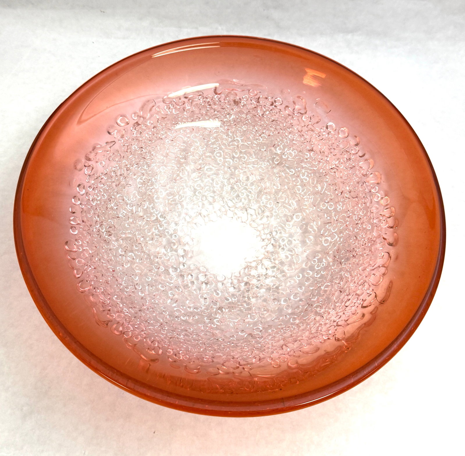 Molly Stone Art Glass dish: Molly Stone Art glass dish in a clear overshot finish shading to a reddish orange rim, 10 1/2" wide. CONDITION: no chips, cracks, repairs, or material defects found, Jaremos attempts to call any mater
