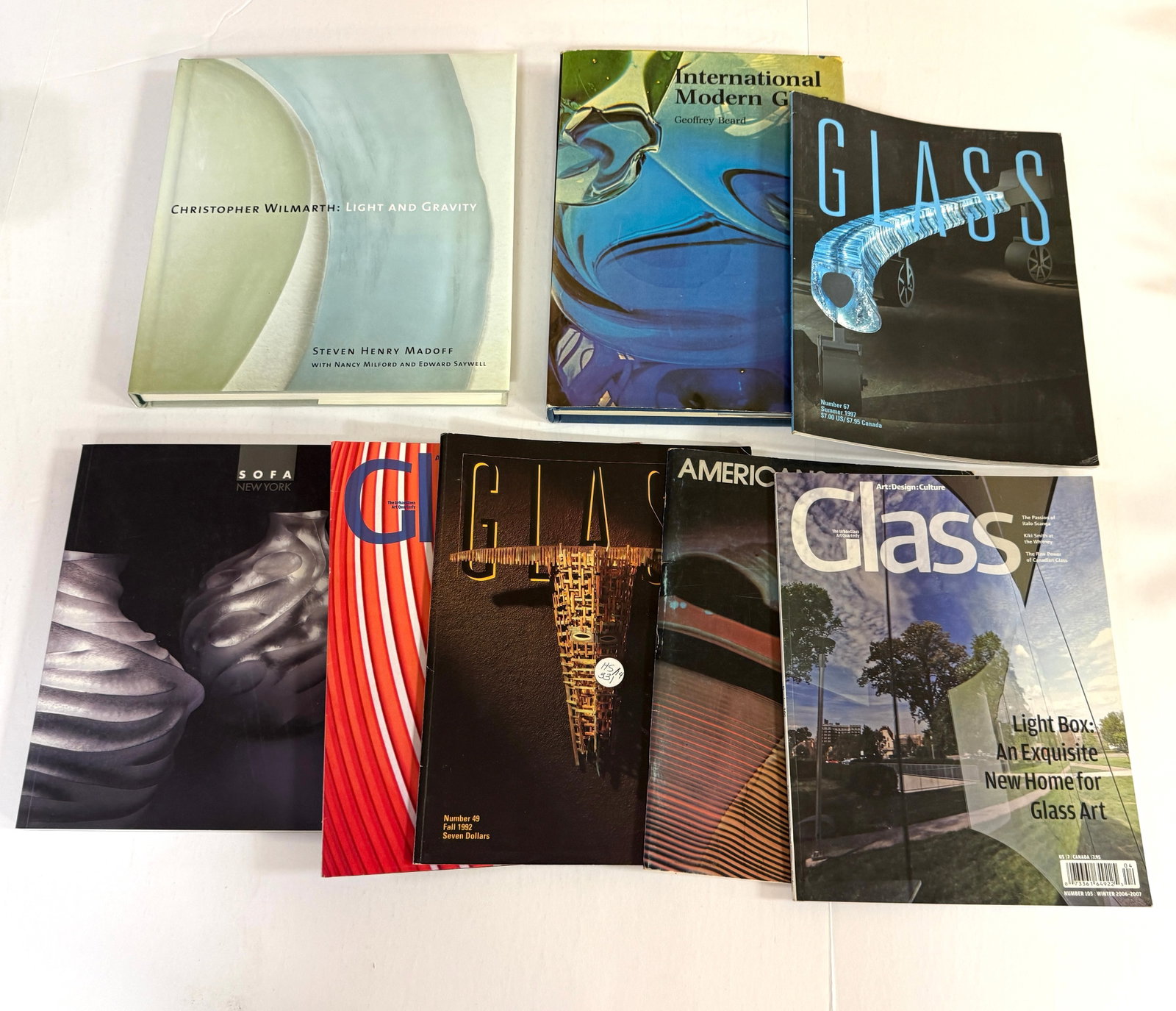 8 Publications on Modern Glass: 8 publications Studio glass including "Americans in Glass 1978" and International Modern Glass, a Sofa catalog for 2008 and more. CONDITION: good