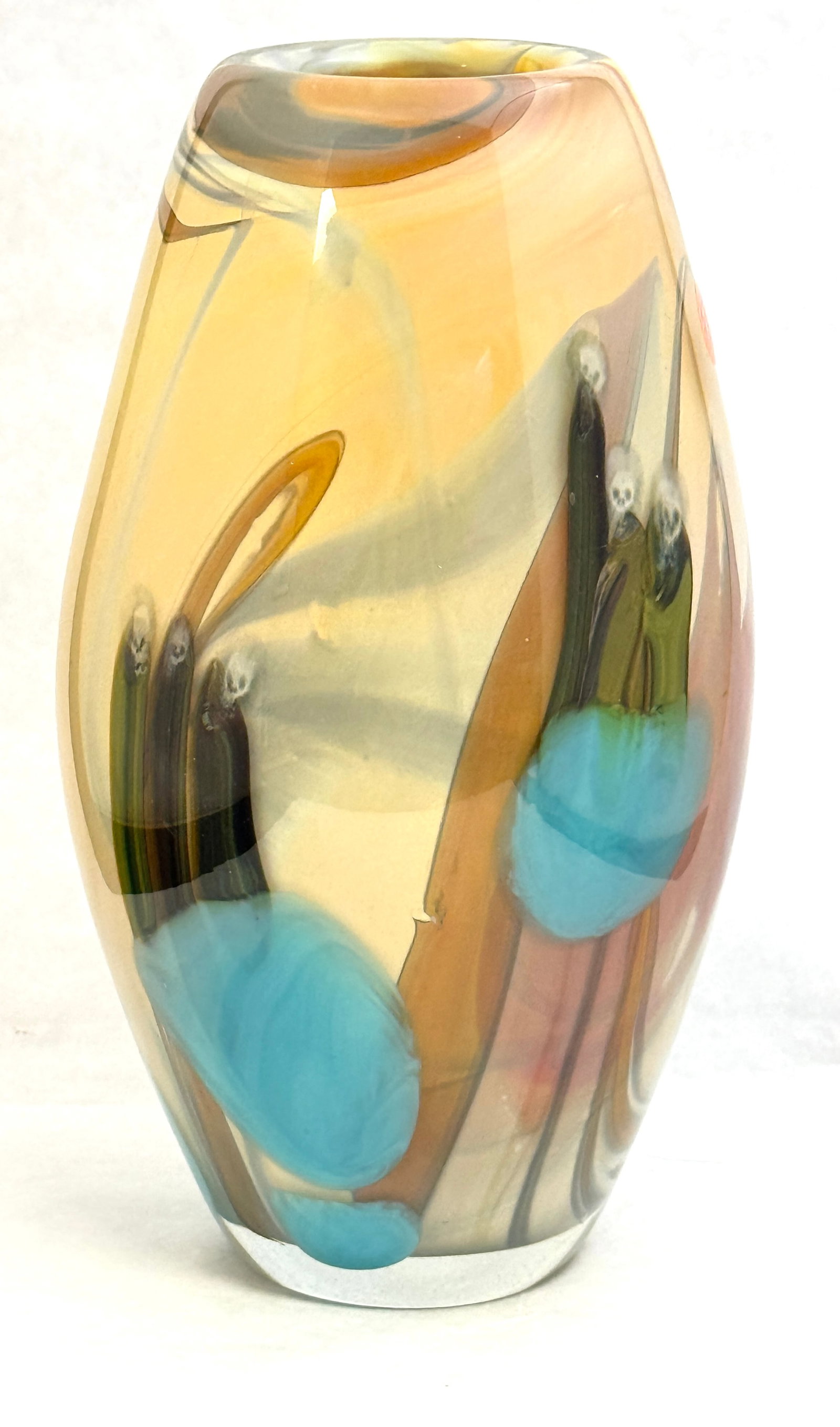 Michael Cohn Paperweight Vase: Michael Cohn paperweight glass vase in amber decorated with colorful striations with splashes of blue and yellow, signed Cohn 81, 11" ht. CONDITION: no chips, cracks, repairs, or material defects