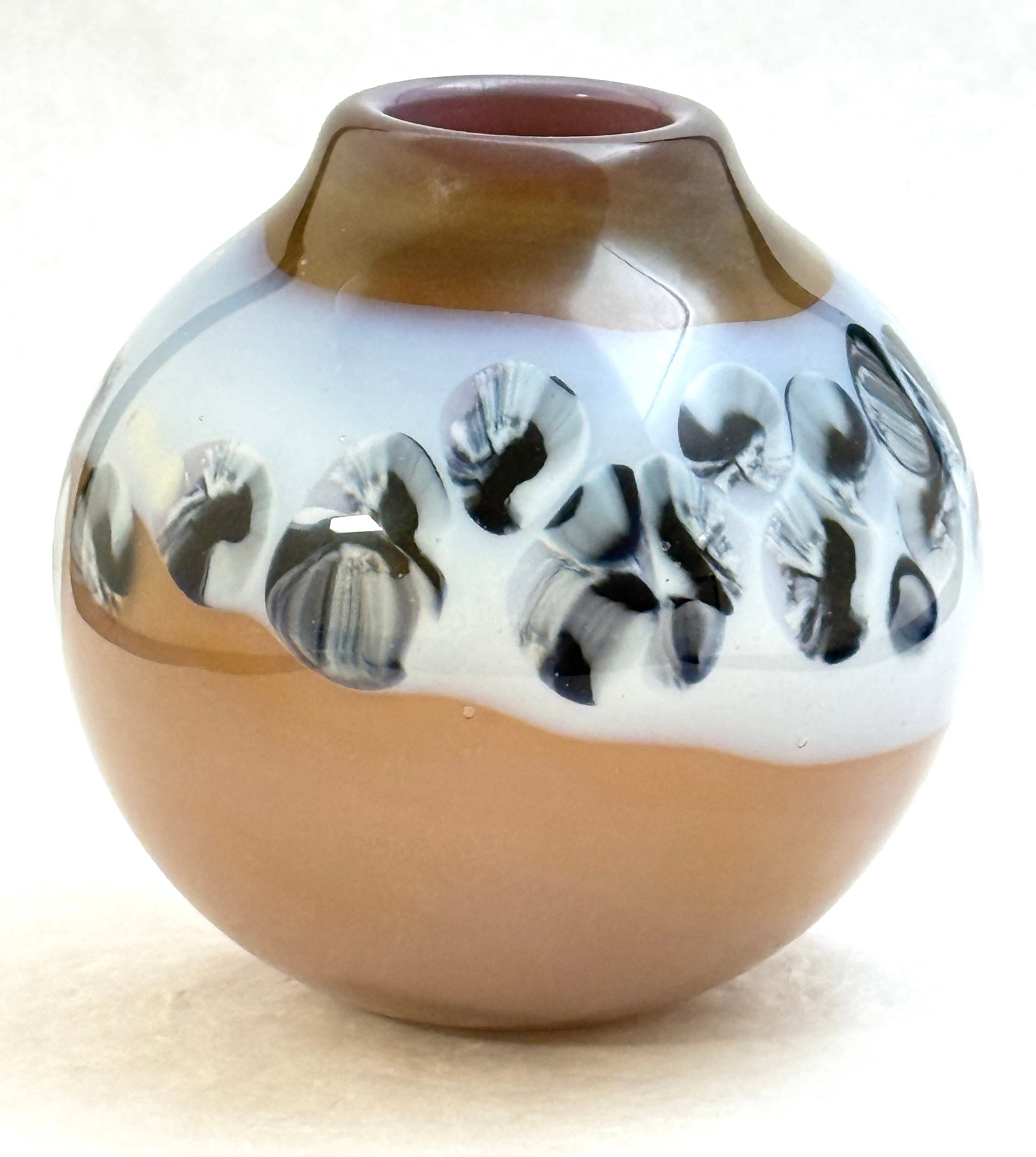 Richard Ritter Art Glass Orb: Richard Ritter art glass orb vase in brown with a blue band of black millefiori, signed Richard Q. Ritter, 5 1/2" ht. CONDITION: no chips, cracks, repairs, or material defects found, Jaremos attempts