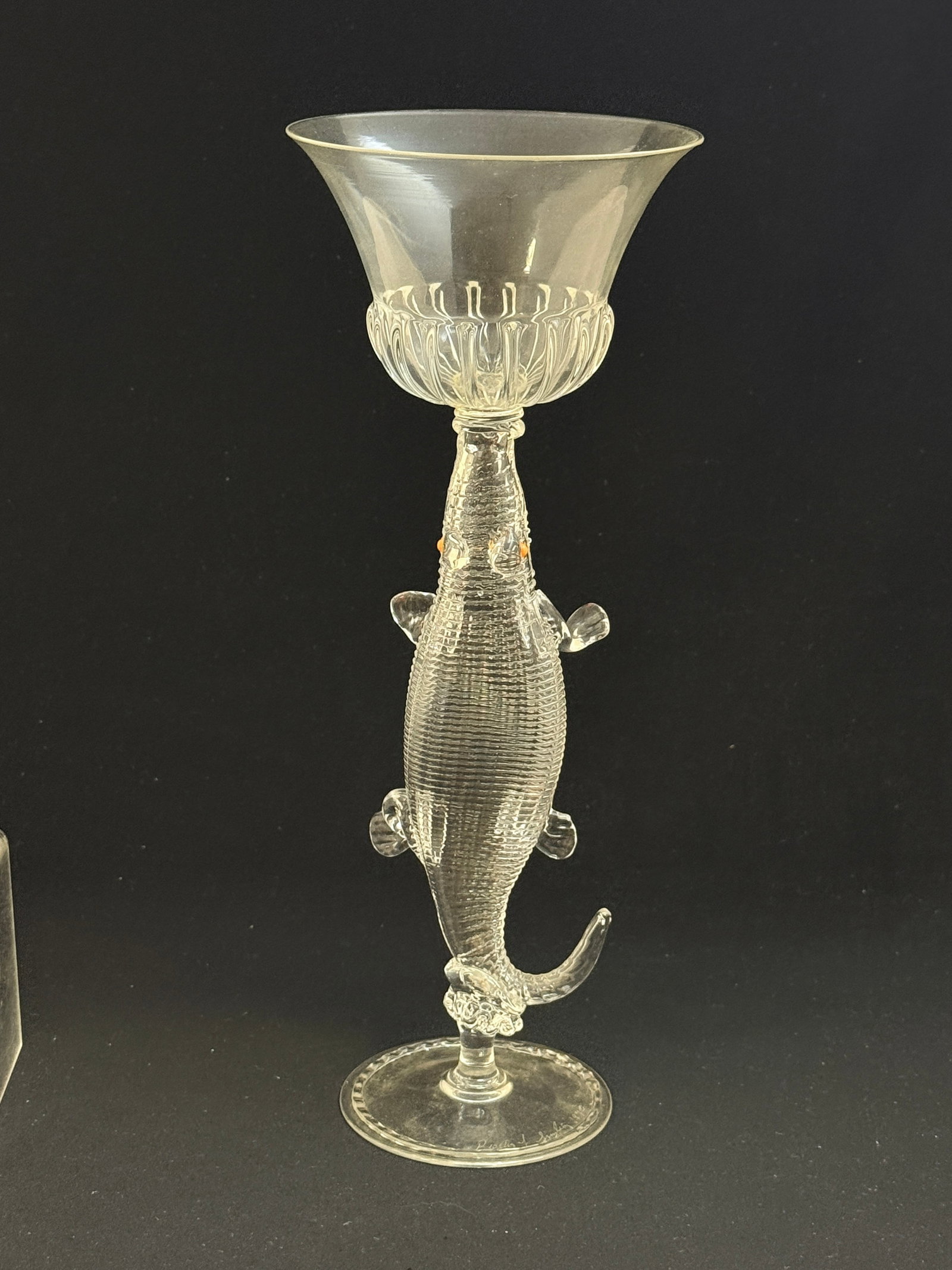 Preston Singleterry goblet: Preston Singleterry clear glass figural goblet in the form of a alligator with orange eyes, signed Preston Singleterry 1990, 11" ht. CONDITION: stem and cup have been glued.