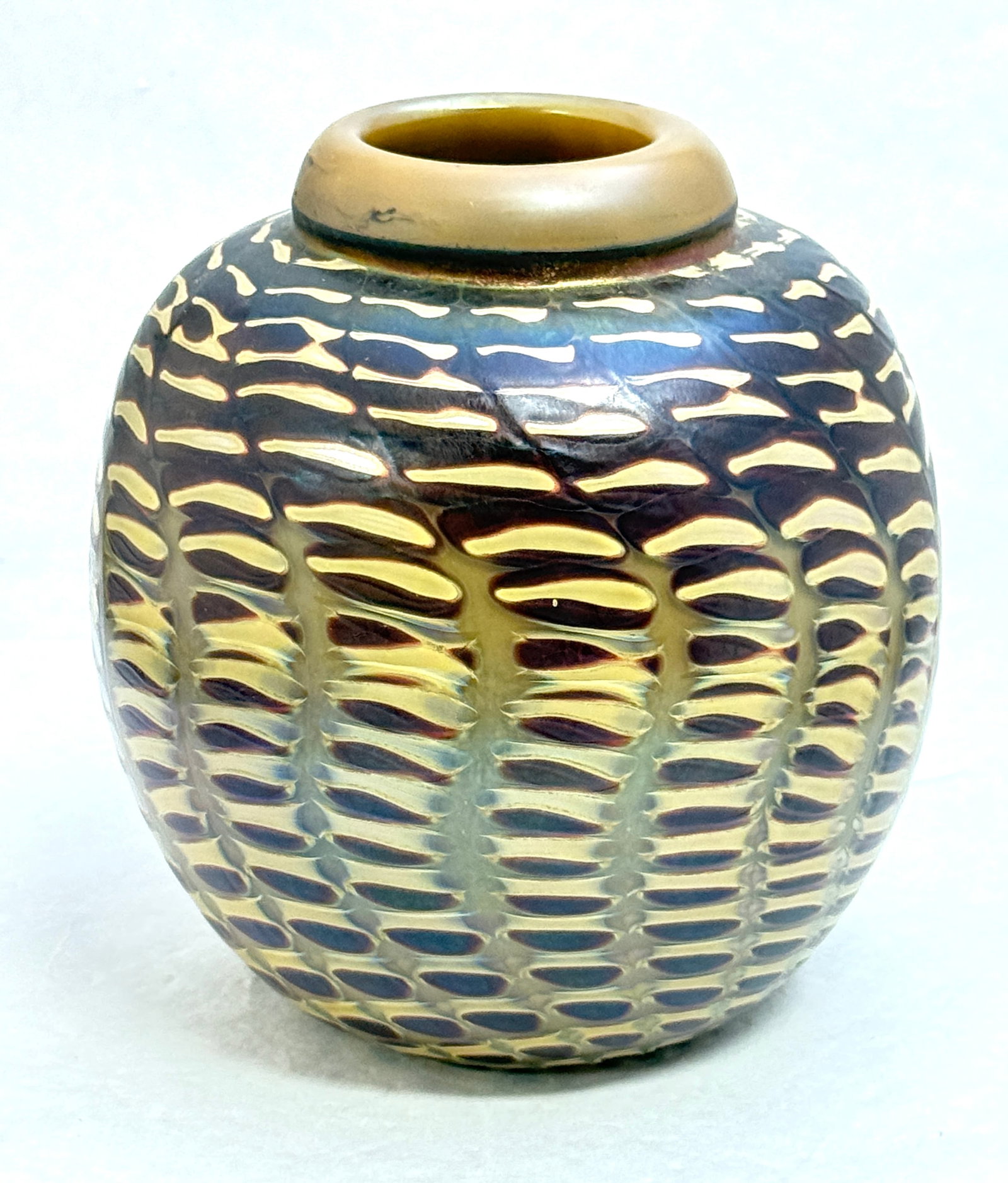 Steve Corriea Zipper Vase: Steve Corriea brown orb with a Crimson zipper pattern, signed Steven Corriea, 6 1/2" ht. CONDITION: no chips, cracks, repairs, or material defects found, Jaremos attempts to call any material flaw