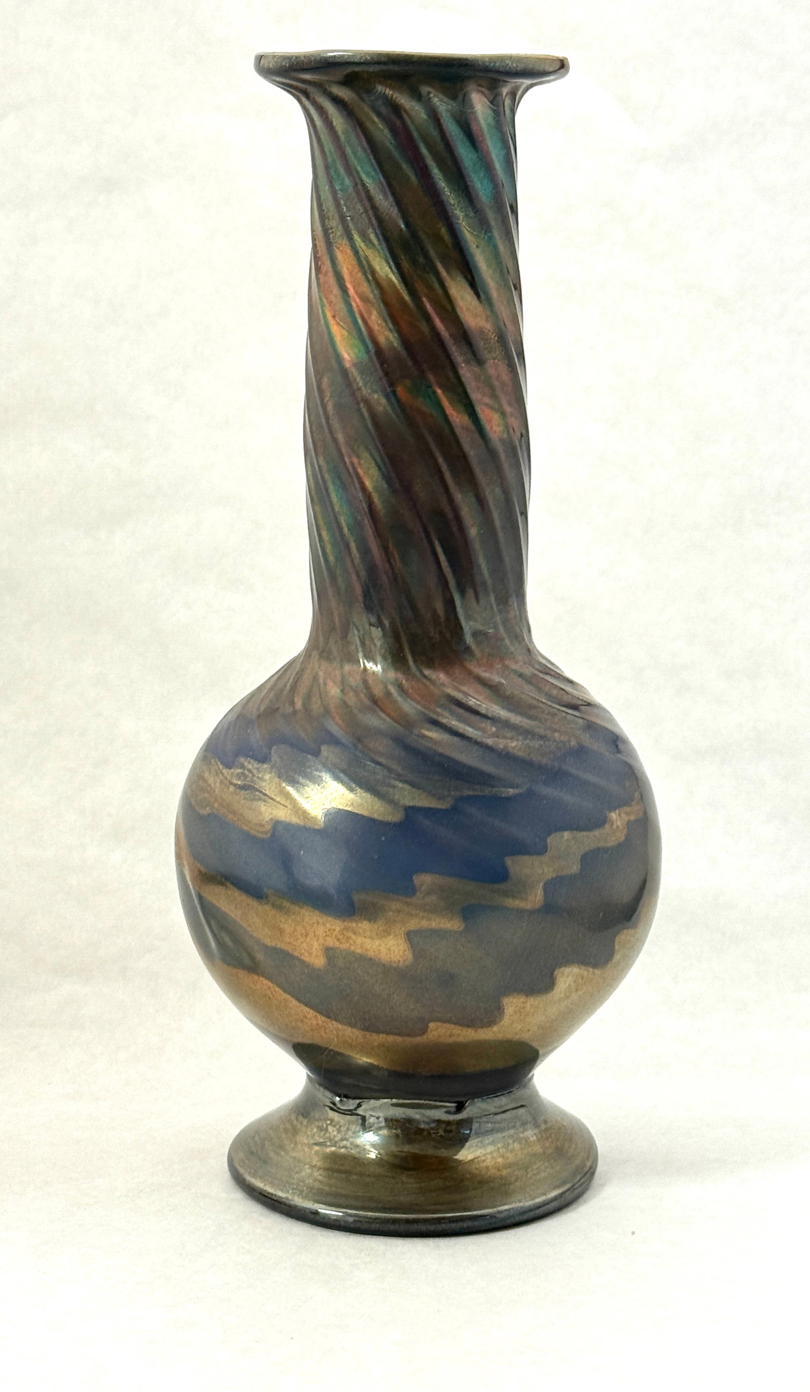 Iridescent Footed Vase: Iridescent gold and blue footed vase with ribbed swirl; 11 3/4" ht. CONDITION: no chips, cracks, repairs, or material defects found, Jaremos attempts to call any material flaw that affects the price,