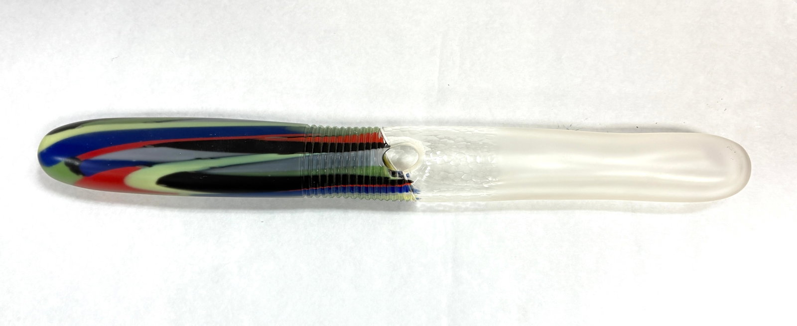 Jane Bruce Pipe Sculpture: Jane Bruce crystal pipe sculpture with red, blue, green, and black splashes of color, signed and dated; 24" long. CONDITION: no chips, cracks, repairs, or material defects found, Jaremos attempts to