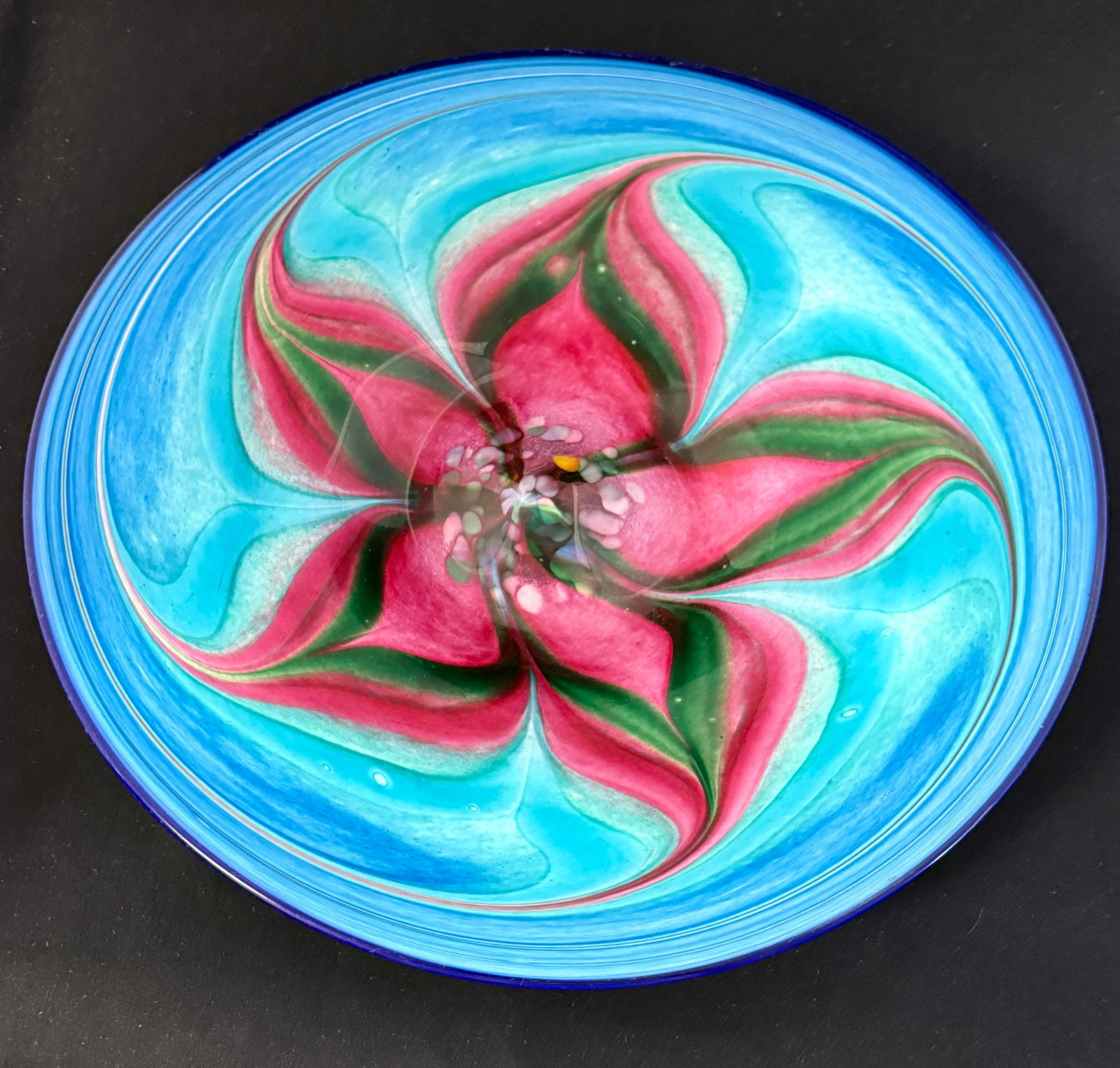 Bermuda Dockyard Glass tray: Dockyard glass tray in blue glass with a rose colored star, signed Bermuda and by the artist; 15" wide. CONDITION: no chips, cracks, repairs, or material defects found, Jaremos attempts to call any