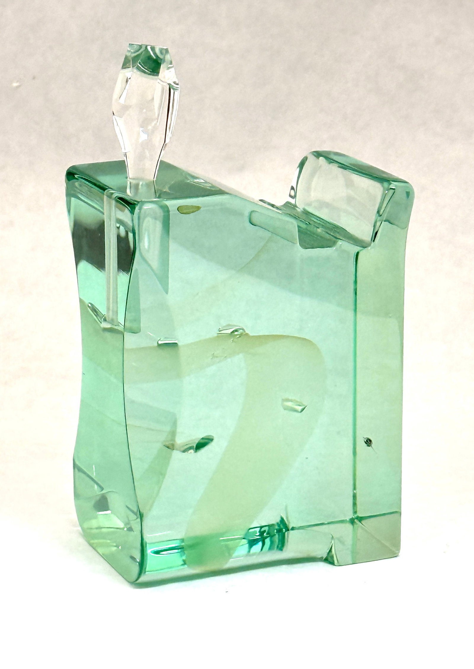 Mark Sudduth Perfume Bottle: Mark Suddeth green art glass perfume bottle, signed Mark J Suddeth; ht. with dopper 6 1/2". CONDITION: several open bubbles and a small glass fold on top.