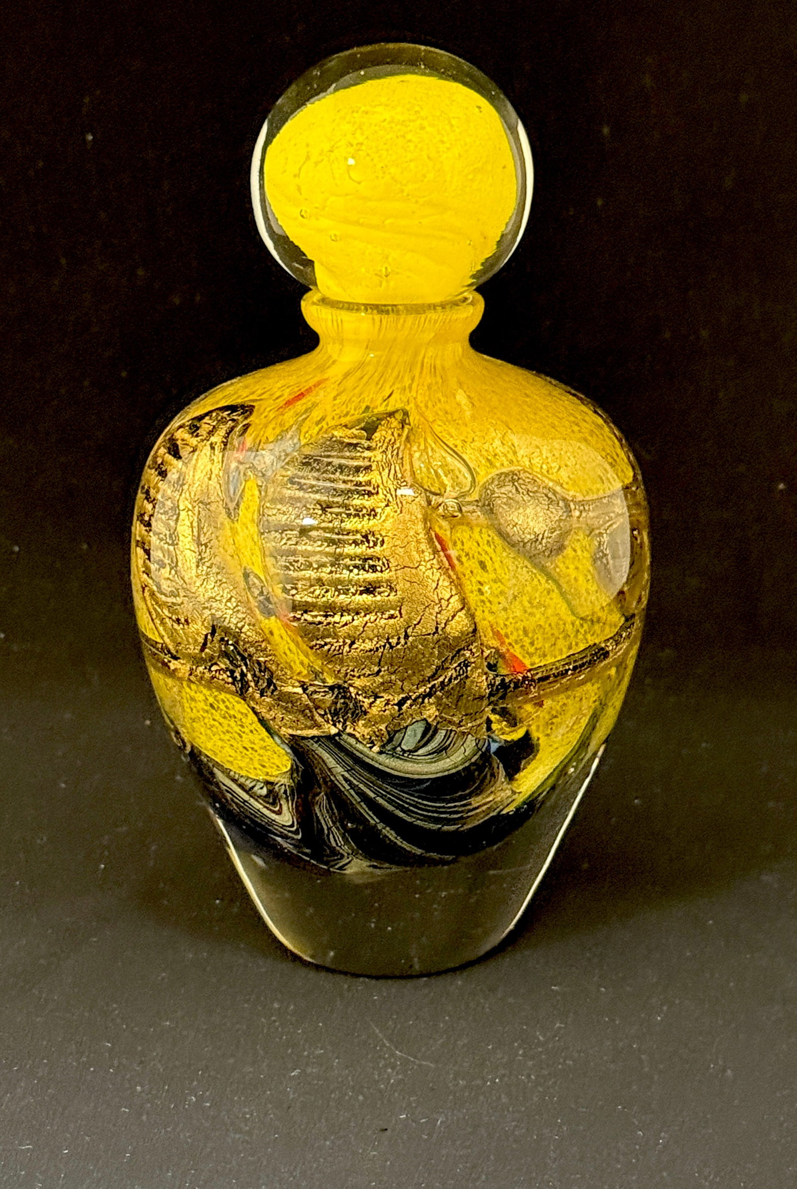 Novaro Art Glass Perfume Bottle: Jean Claude Novaro small yellow with gold and grey perfume bottle with bulbous dobber, signed JC Novaro 1991; ht. 8".with dopper. CONDITION: no chips, cracks, repairs, or material defects found,