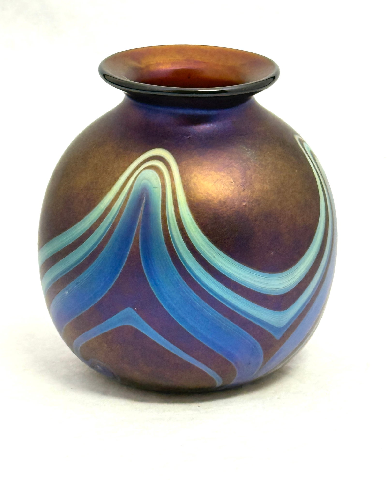 Charles Lotton Dark Purple Vase: Charles Lotton dark purple orb decorated with a blue pulled feather, signed Lotton 1972 #617, 5" ht. NOTE: Collection of Joan Allen Walker, an early collector of Lotton Glass and purchased items exclu