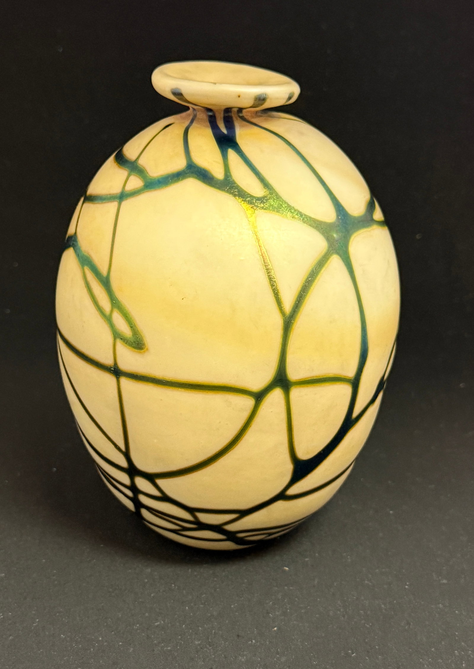 Very Early Charles Lotton Vase: Very early Charles Lotton vase in opal glass with an iridescent blue webbing, free form rim, 7 1/4" ht. NOTE: Collection of Joan Allen Walker, an early collector of Lotton Glass and purchased items