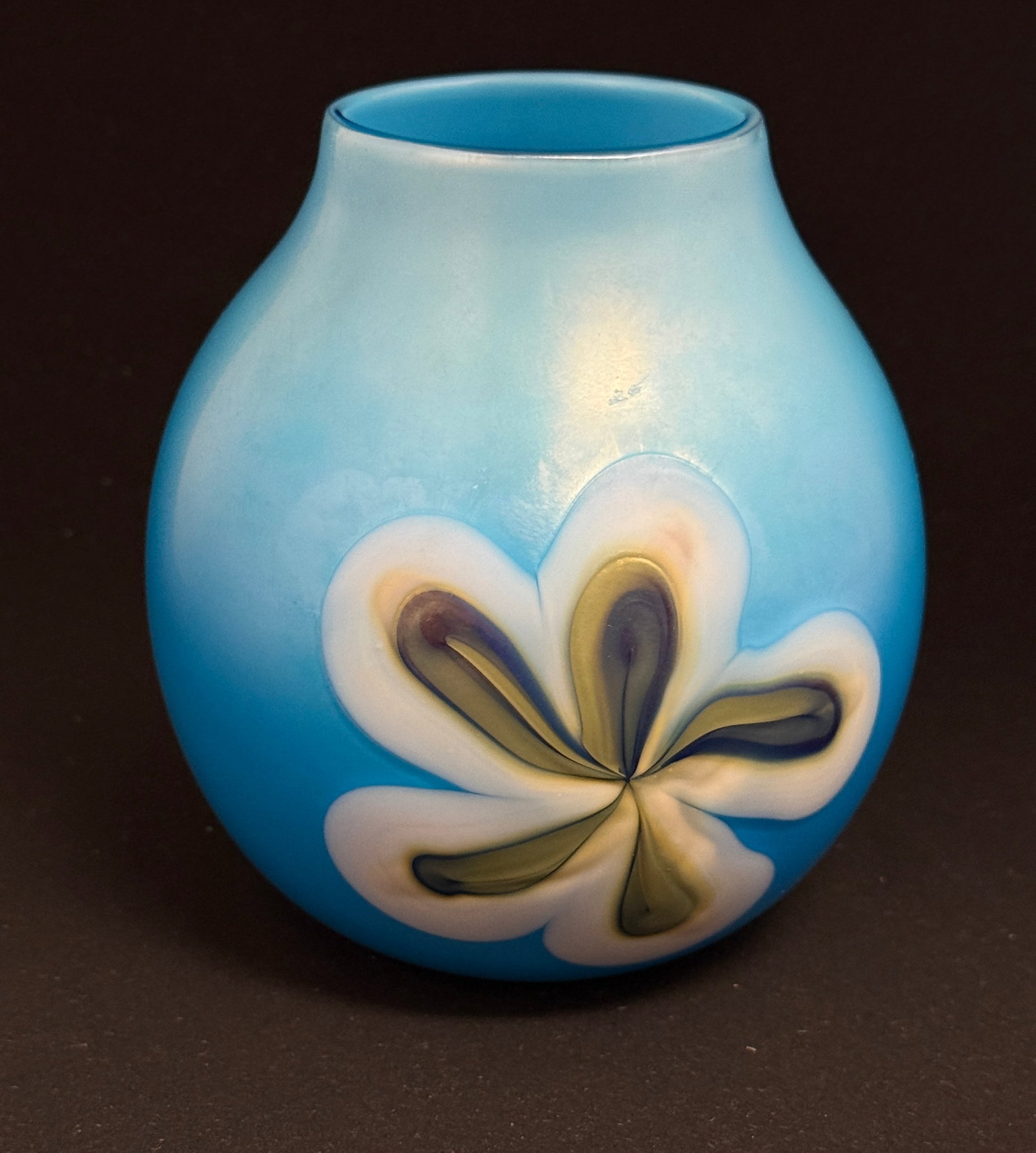 Charles Lotton Baby Blue Vase: Charles Lotton baby blue ovoid vase decorated front and back with a five pedal flower in white and gold, signed Lotton 1973, 5 3/4" ht. NOTE: Collection of Joan Allen Walker, an early collector of