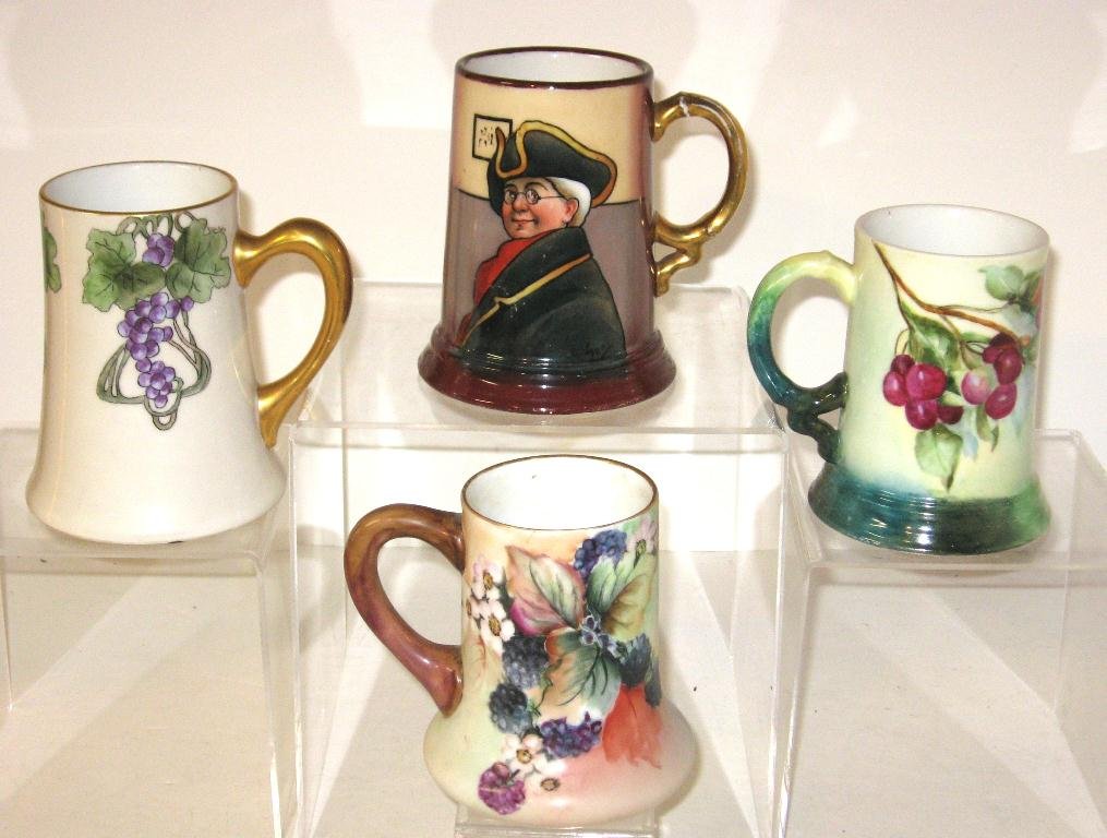 Four Limoges hand painted tankard mugs,: including one each with Raspberries, Cherries, Art Nouveau Gapes, and a Colonial man, two marked JP France, two marked Limoges, 5 1/4" ht.