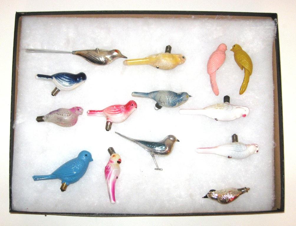 14 Vintage Christmas bulbs and ornaments,: early 20th century Christmas bulbs and ornament of birds consisting of 9 bulbs and 5 ornaments set in a glass shadow box, longest 5" long.