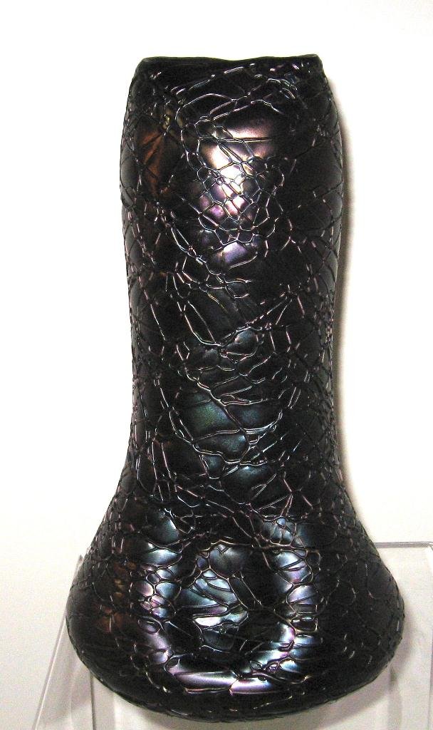 Large Palme Konig iridescent glass vase,: bulbous pinched sided cylindrical form in deep purple glass decorated with overall random threading, 10 1/2" ht.