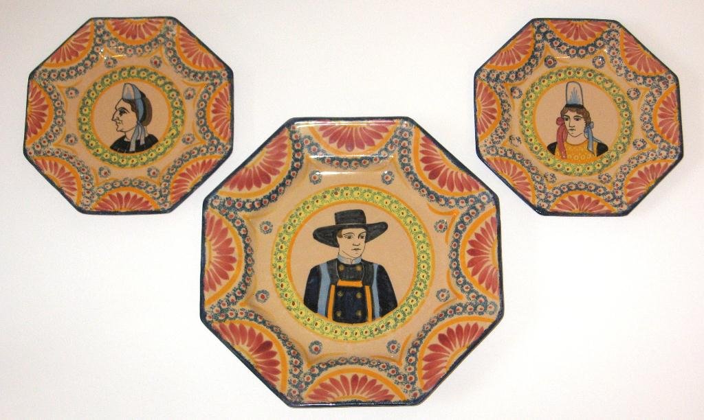 (3) Henriot Quimper faience "Ivoire Corbeille" plates,: octagon-form with Breton man and two Bretonne women. 8"-10 3/4". c.1940-1950.