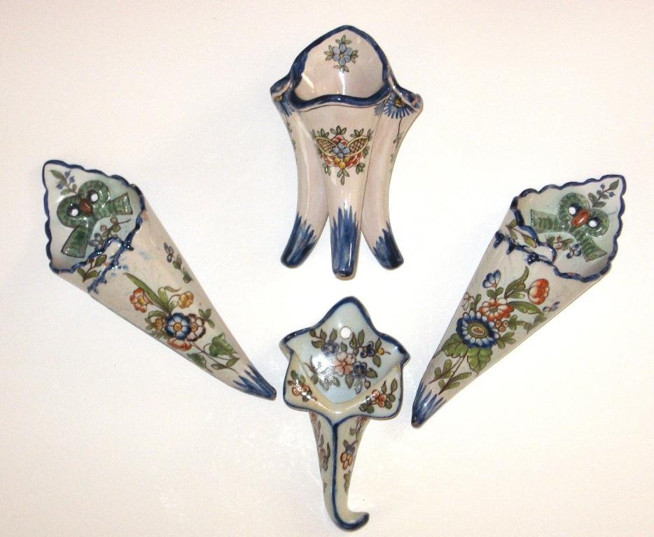(4) pcs. French faience Nevers & Desvres,: including a 5 1/2" ht. Nevers tricorn vase; a pr. of Nevers 7 1/4" ht. cornet-shaped wall pockets signed A. Montagnon and an unmarked Desvres cornet wall pocket. 7 1/4" ht. c.1920