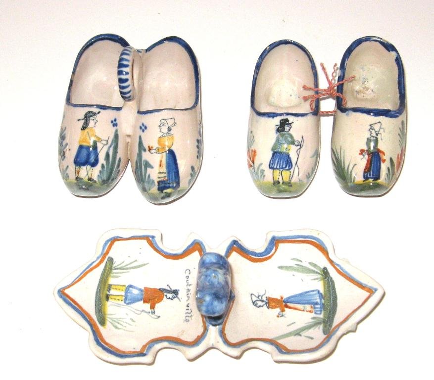 Quimper faience double salts, fleur-de-lis,: and sabot forms. HenRiot Quimper "Coutainville" in fleur-de-lis form with blue sponged fleur-de-lis finial. HR Quimper double salt sabot-form and two sabots tied together, all with Breton & Bretonne f