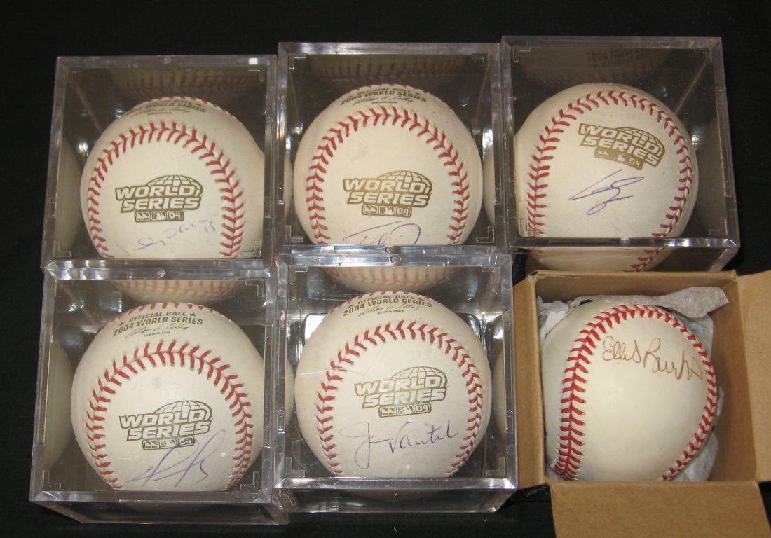 Six signed 2004 Boston Red Sox World Series,: Five on World Series 2004 official balls, including Johnny Damon, Jason Varitek, David Ortiz, Trott Nixon, and one un-identified. Together with a Ellis Burks.