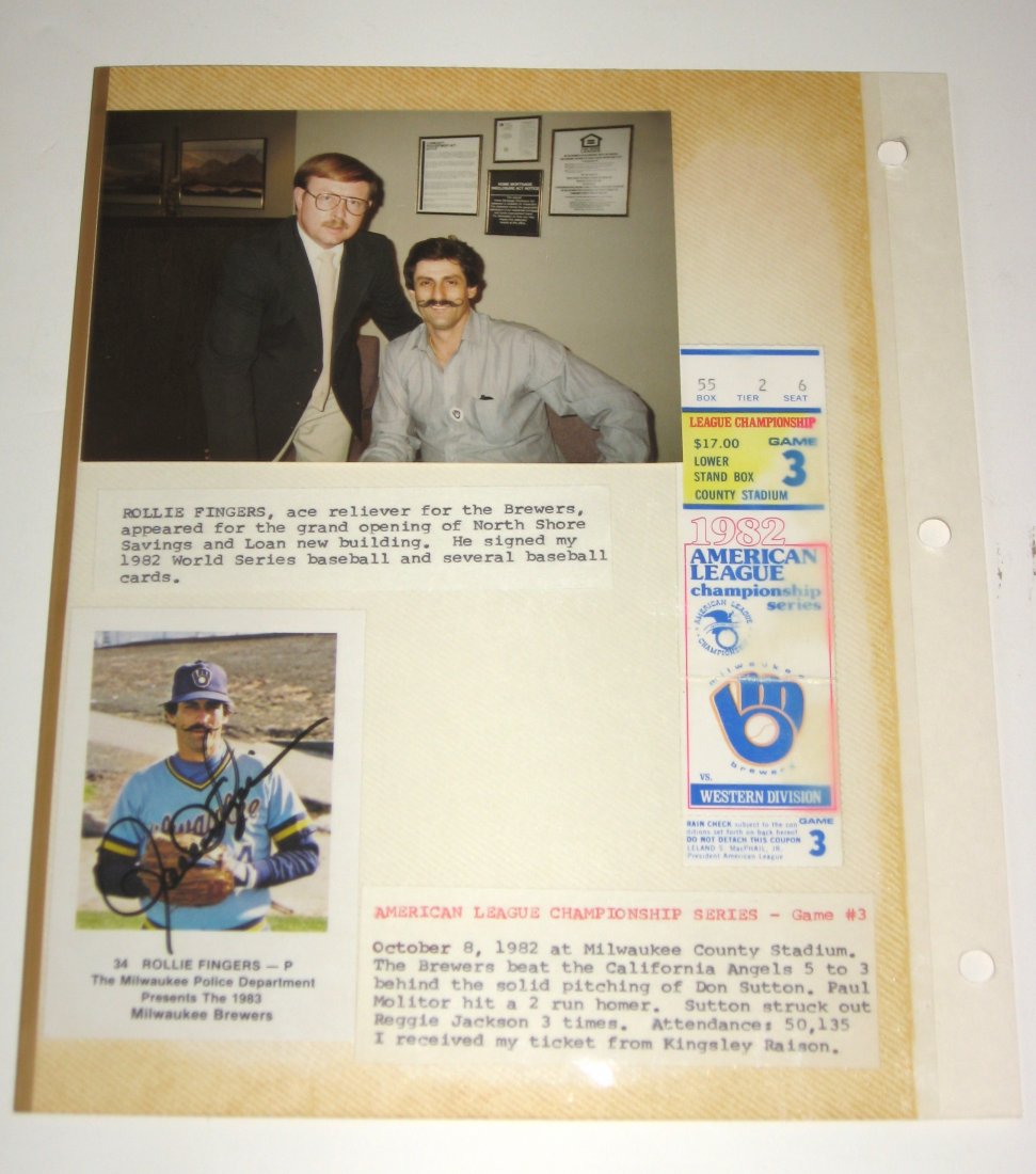 Lot of Rollie Fingers baseball items,: including a sheet from Martin's autograph book showing a picture of Martin with Rollie, a signed card and an American League Championship series ticket from 1982.