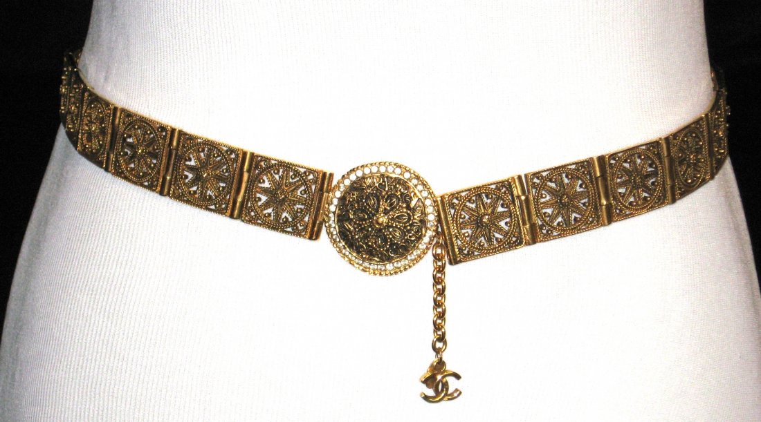 Chanel gold tone belt,: Metal belt with a pierced Moorish design, buckle with crystal jewels and double CC chain, 29 1/2" long