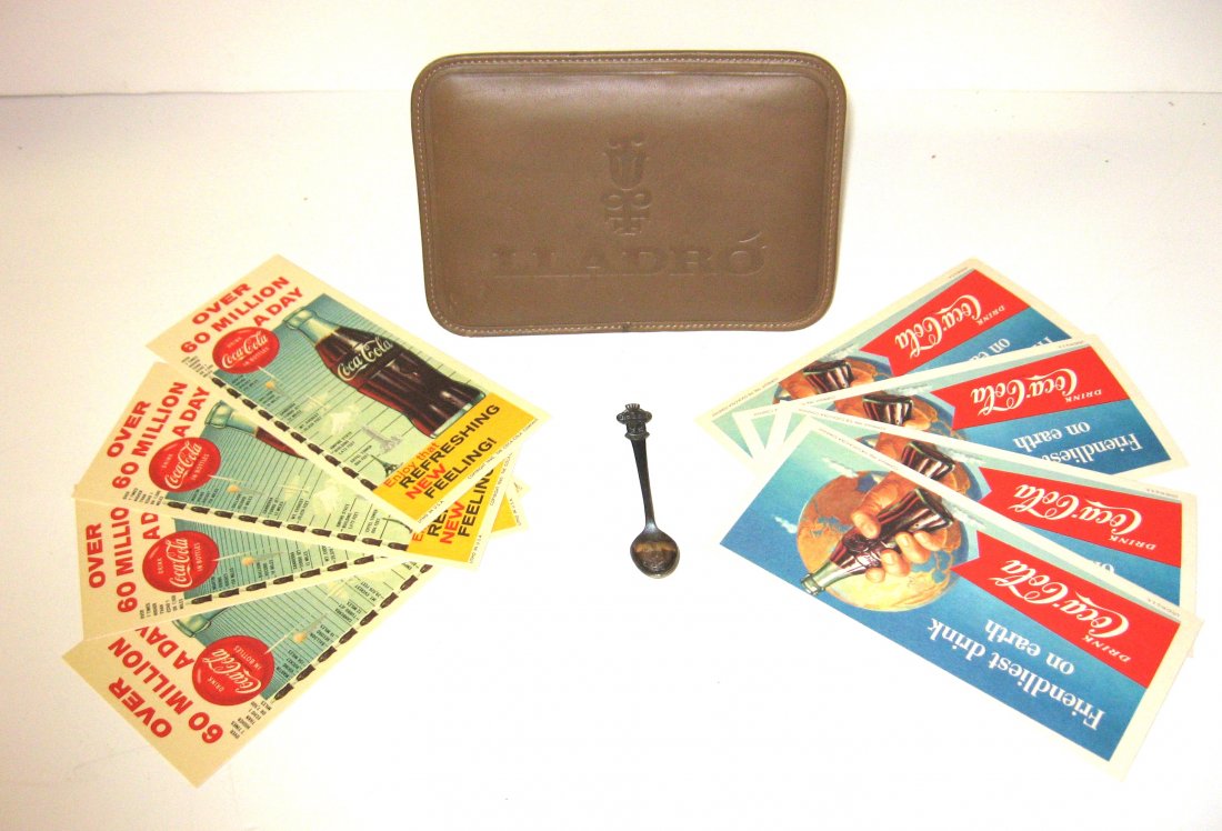 Group of advertising items, Rolex, Lladro,: including a leather Lladro retail sign, a Rolex Bucherer of Switzerland spoon, 4 1956 Coca Cola Ink blotters and four 1969 blotters, blotters 7 1/2" long.