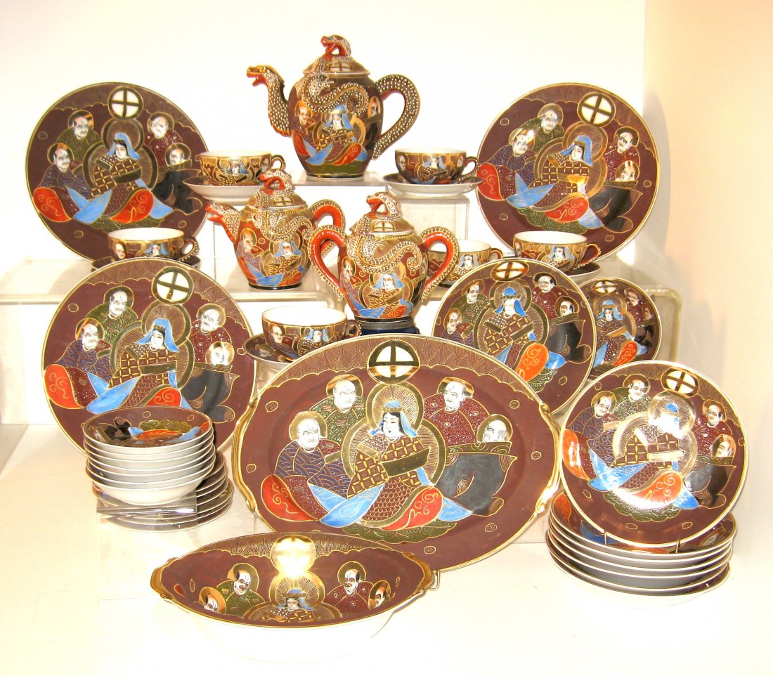 43 piece Japanese Satsuma china and tea set,: brown enameled tea set decorated with the immortals each with a red back stamp, the tea pot creamer and sugar with different mark then the rest.