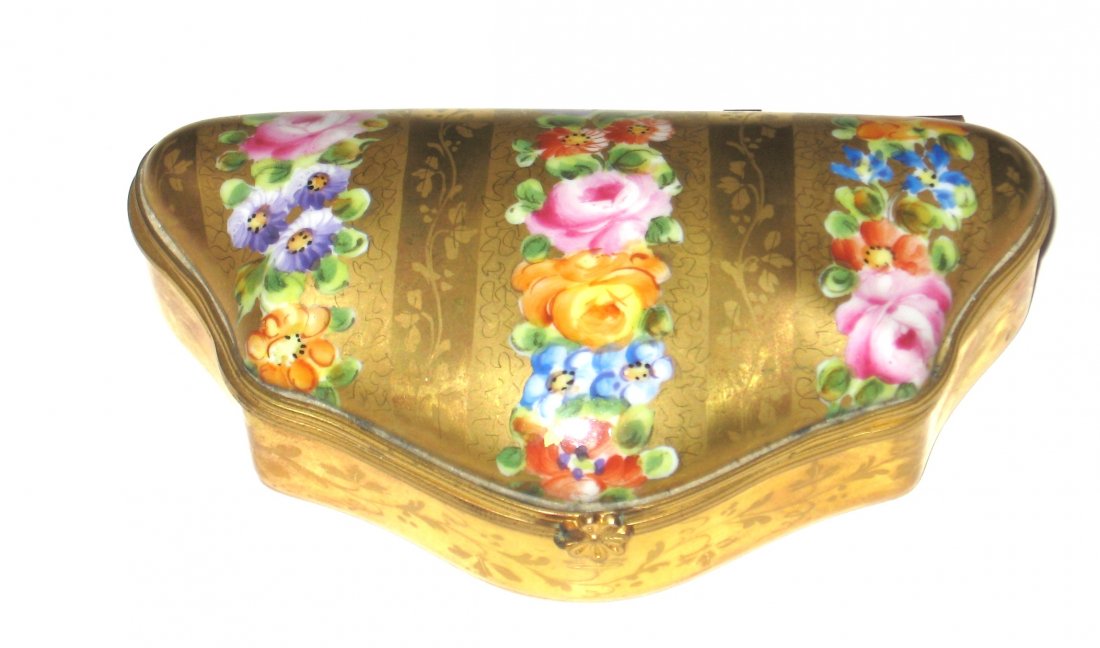 Le Tallec porcelain dresser box,: Pillow form in overall gold with tracery decorated with bands of colorful flowers, marked Le Tallec a Paris France LT date and artist mark, carries a Christies paper label, 4 1/2" long.