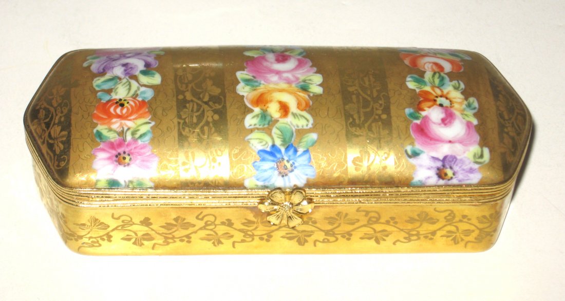 Le Tallec elongated dresser box,: overall gold tracery decorated with bands of colorful Flowers, marked with the Dessine' et peint entie'rment peint a' la main par Le Tallec a' Paris France, translated Drawing and painted by hand by L