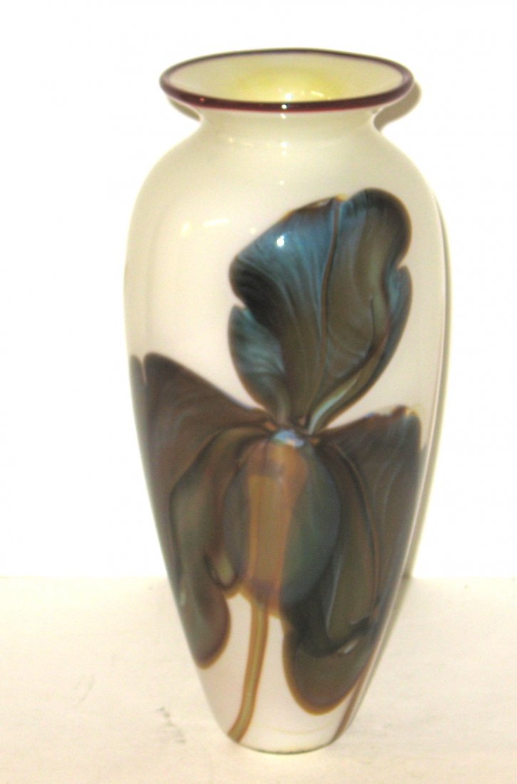 Rick Satava art glass vase,: cylindrical form in white glass with crimson lip wrap decorated with large blue and purple iris, signed Satava 94, 9 3/4" ht.