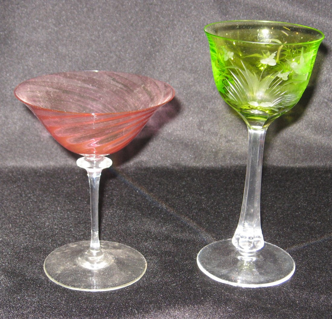 Steuben Moser art glass goblets,: including a cranberry Steuben, together with a faceted cut green Moser with deer and forest scene, tallest 7" ht.