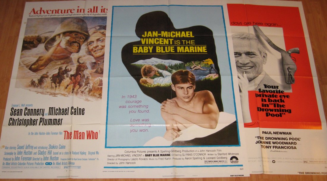 Connery, Michael Caine, Newman posters,: Original posters Including 1975 "The Man Who Would Be King" a John Huston film, 1975 "The Drowning Poll" staring Paul Newman and Joanne Woodward, and 1976 "Baby Blue Marine" staring Jan-Michael Vincen