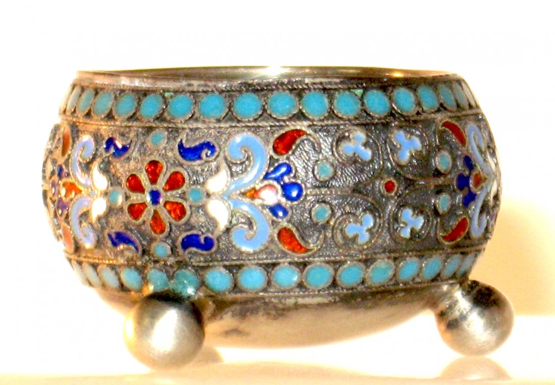 Russian Gustav Klingert footed silver salt,: ovoid form on three ball feet decorated with central red flowers surrounded with blue foliage, marked 84 Klingert, 1 1/2" wide.