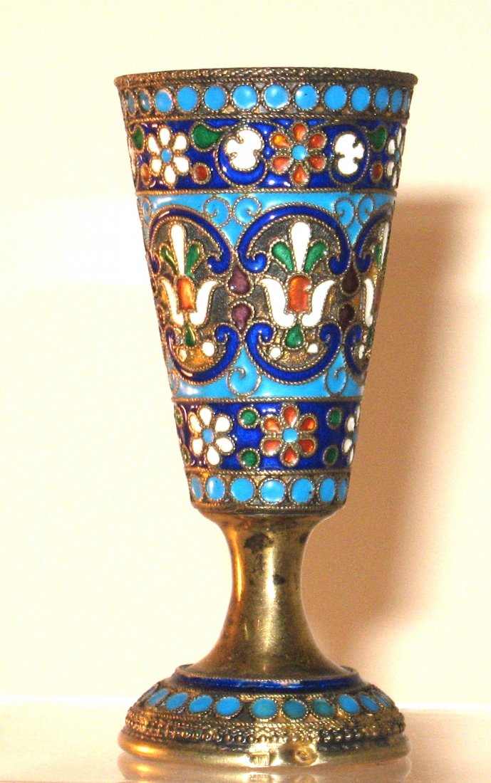 Russian silver footed beaker,: Footed goblet form with white, red and green central flowers in blue frames, marked 84 nm believed to be for Peter Milyukov, 2 3/4" ht.