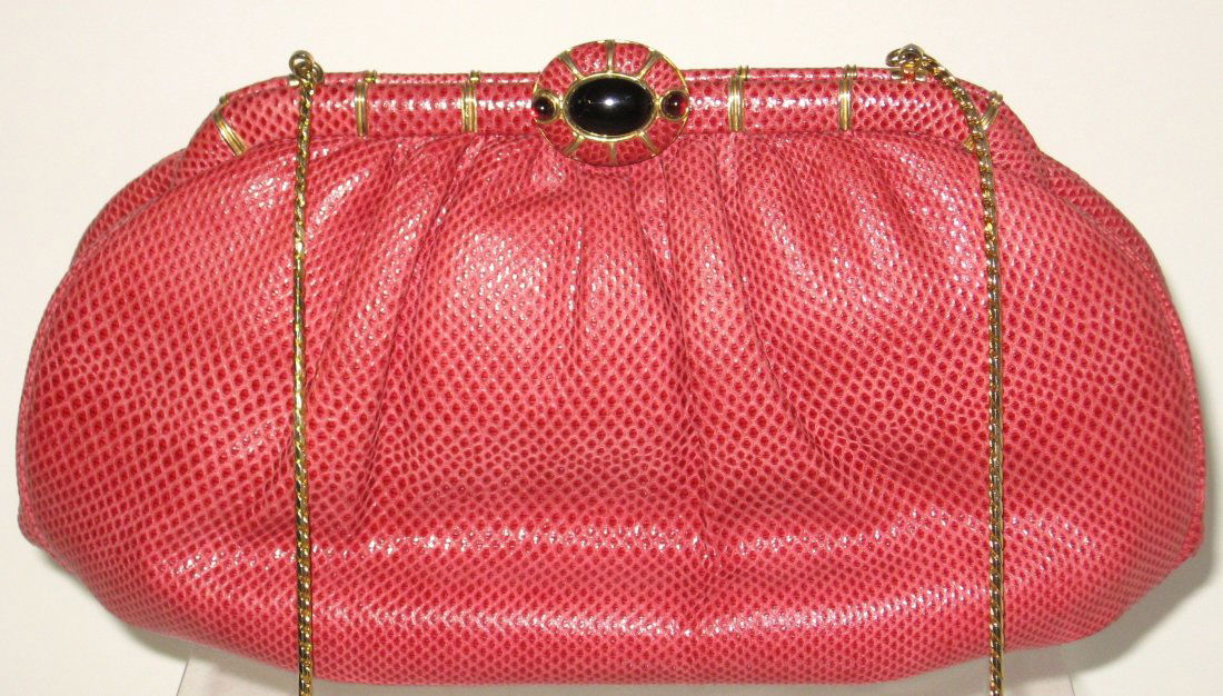 Judith Leiber red snake skin shoulder clutch,: Jeweled clasp snake skin purse with cloth change purse and gilt metal swing mirror and comb, marked with a gold tag on the inside, mirror and comb also marked, has care labels, 5 1/2" ht. by 10 1/2" l