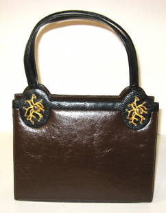 Martin Van Schaak handbag,: brown leather with black trim accented with silver beaded gilt coral, marked Martin Van Schaak, without handle 9 1/2" wide by 7" ht.