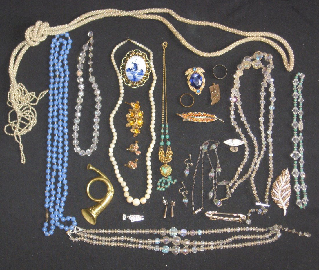 Group of Costume jewelry,: Including a Sterling Chicago Charm, a Trifari broach, a Moorish style drop necklace and more over 25 items.