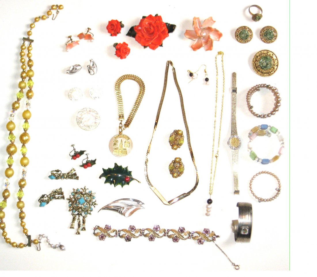 Group of Costume jewelry,: Consisting of multiple sets of earrings and matching pins, including a Trifari Art Deco pin and earrings, and a Cora Gold Tone bracelet with purple jewels, 35 items.