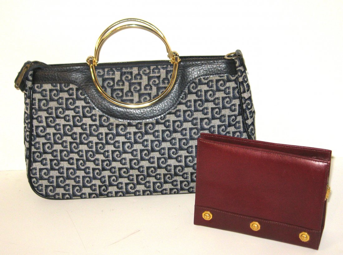 Pierre Cardin and Anne Kline bags,: Including a black cloth Pierre Cardin with adorned with factory emblems, together with a purple leather Anne Kline clutch with gold trim, 13" long.