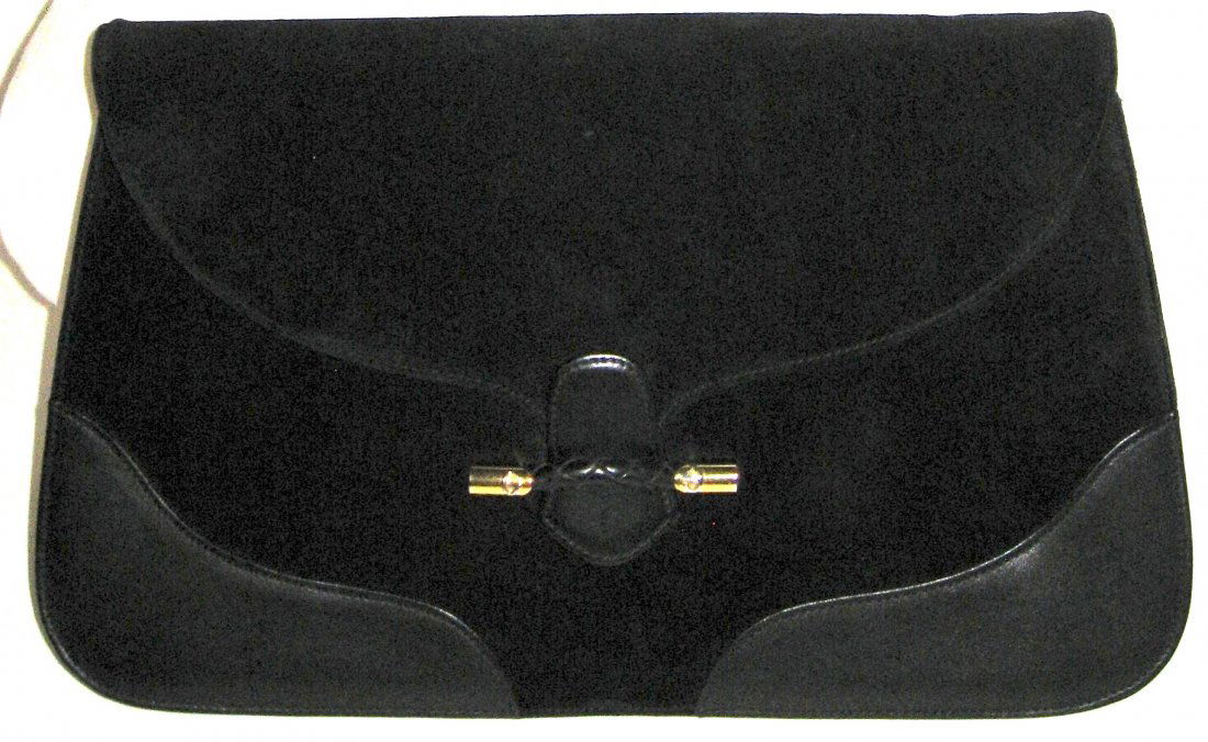 Very fine Suede and leather Gucci purse,: Large black clutch with gold tone hardware marked GG, black leather interior marked Made in Italy Gucci, comes with original white cloth dust bag, unusual large size clutch 13" long by 8" ht.