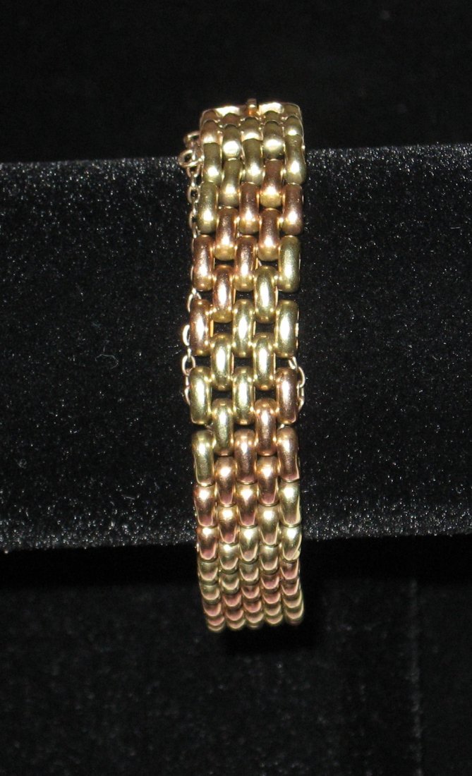 Russian 14K gold bracelet,: quadruple strand bracelet in a two tone yellow and copper, hallmarked with a right facing head 56 and Cyrillic rw, reverse of the clasp inscribed SR 9-25-19, 24 grams.