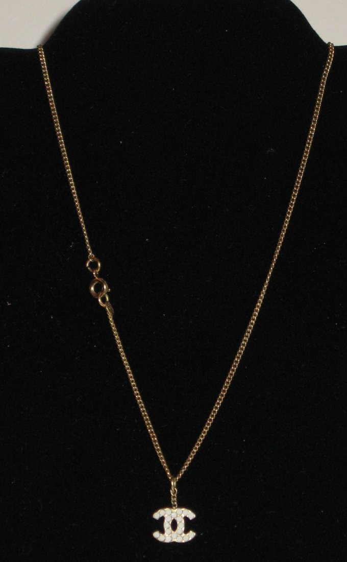 Channel double CC necklace,: Jeweled double CC drop necklace with a thimble counter weight, marked Chanel.