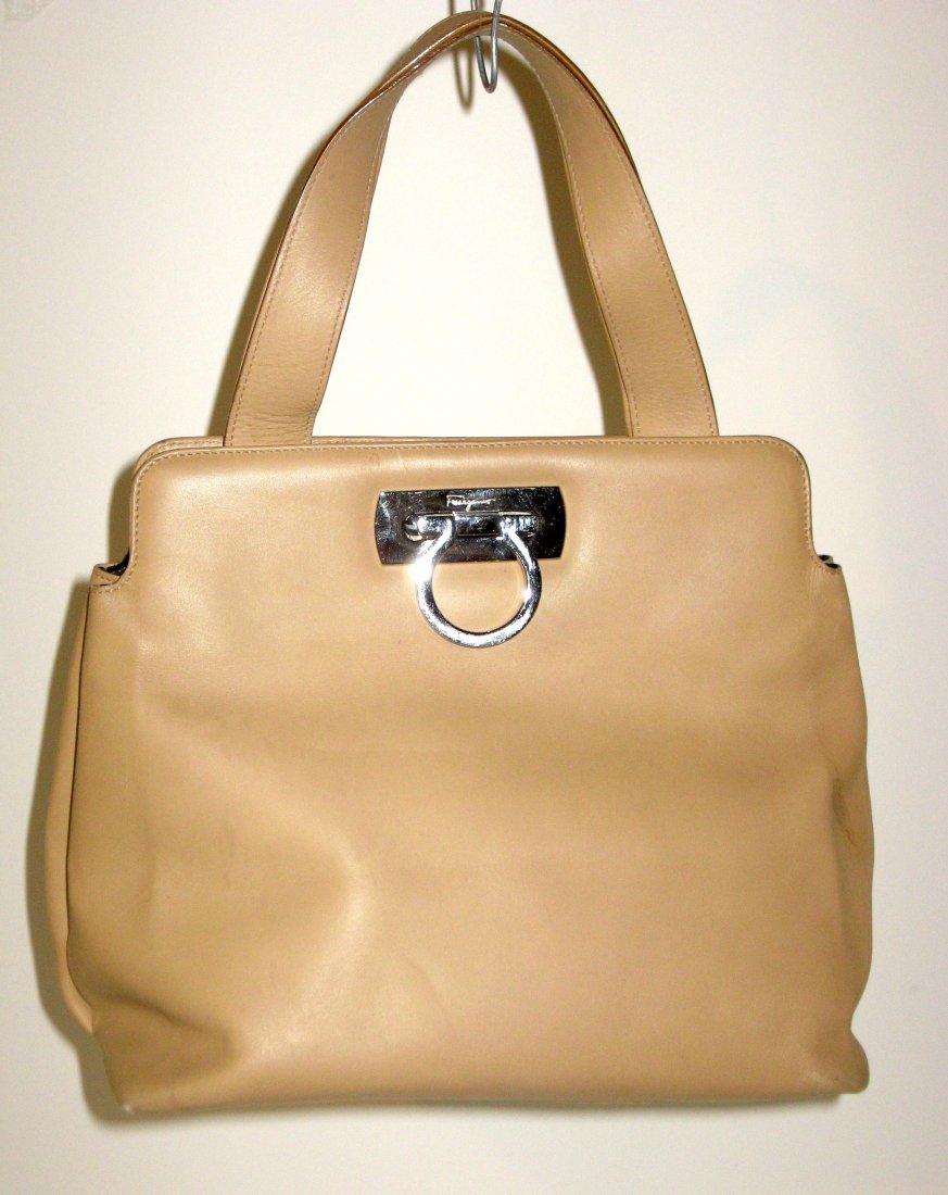 Tan Ferragamo leather purse,: Tan purse with silver clasp marked Ferragamo, interior of clasp marked Made in Italy, 10" long by 8" ht.