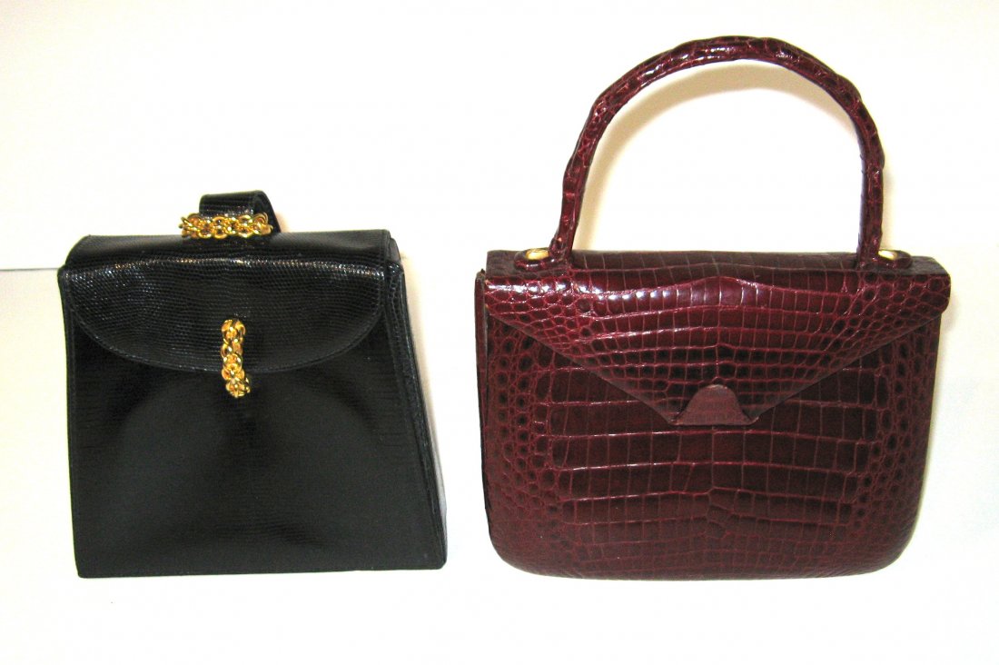 Two Vintage leather hand bags,: Including a purple alligator bag, together with a Paloma Picasso black bag with gold tone clasp, largest without handle 9 1/2" long by 7" ht.