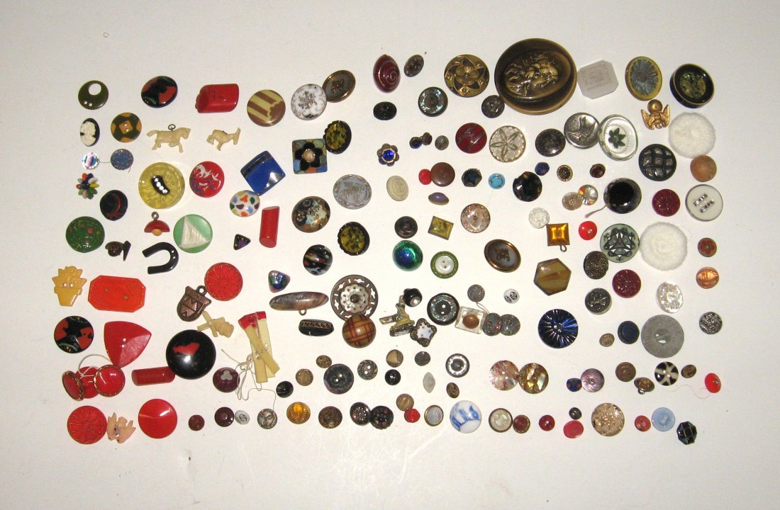 Button Collection, fancy,: Group of colorful fancy buttons, various materials, consisting of Bakelite animals figures and flowers, enameled porcelain and more, over 160 buttons.