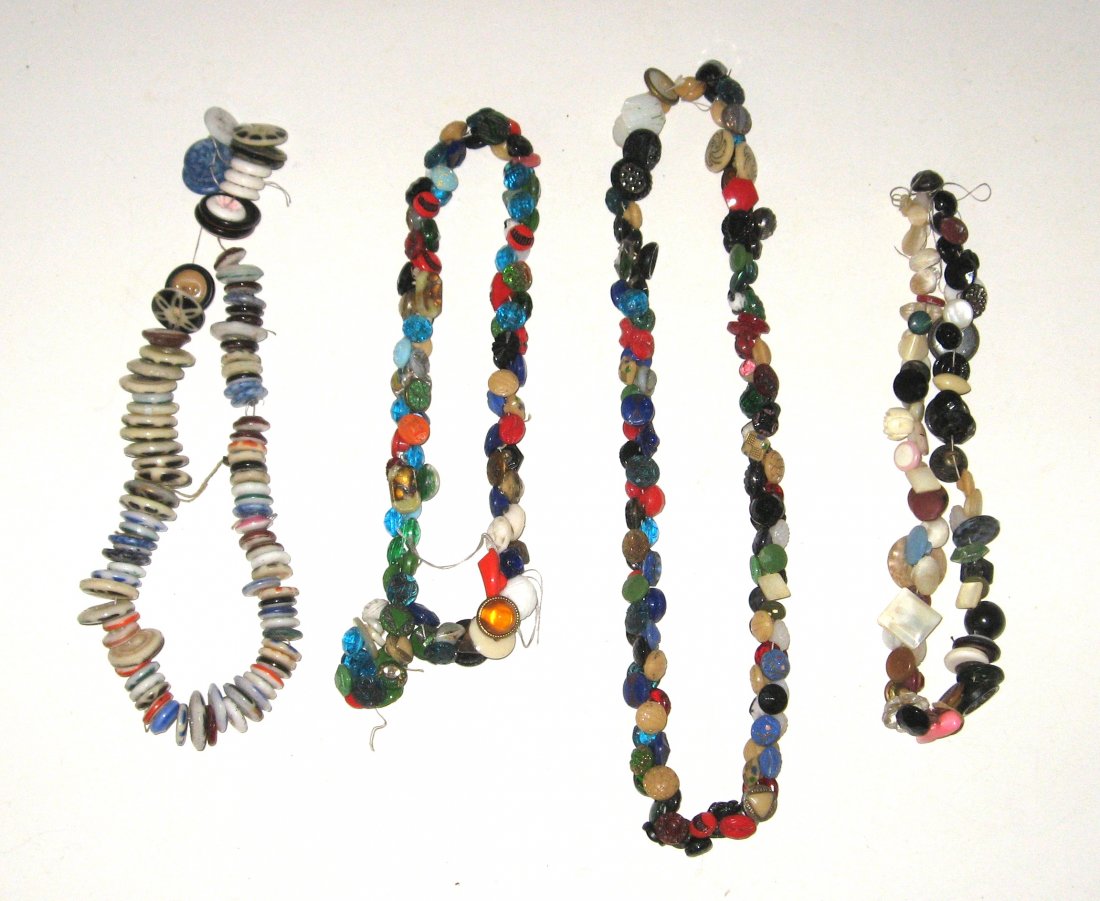 Button Collection, bead and fancy,: Over 300 bead, balls and other colorful buttons strung on four necklace threads.
