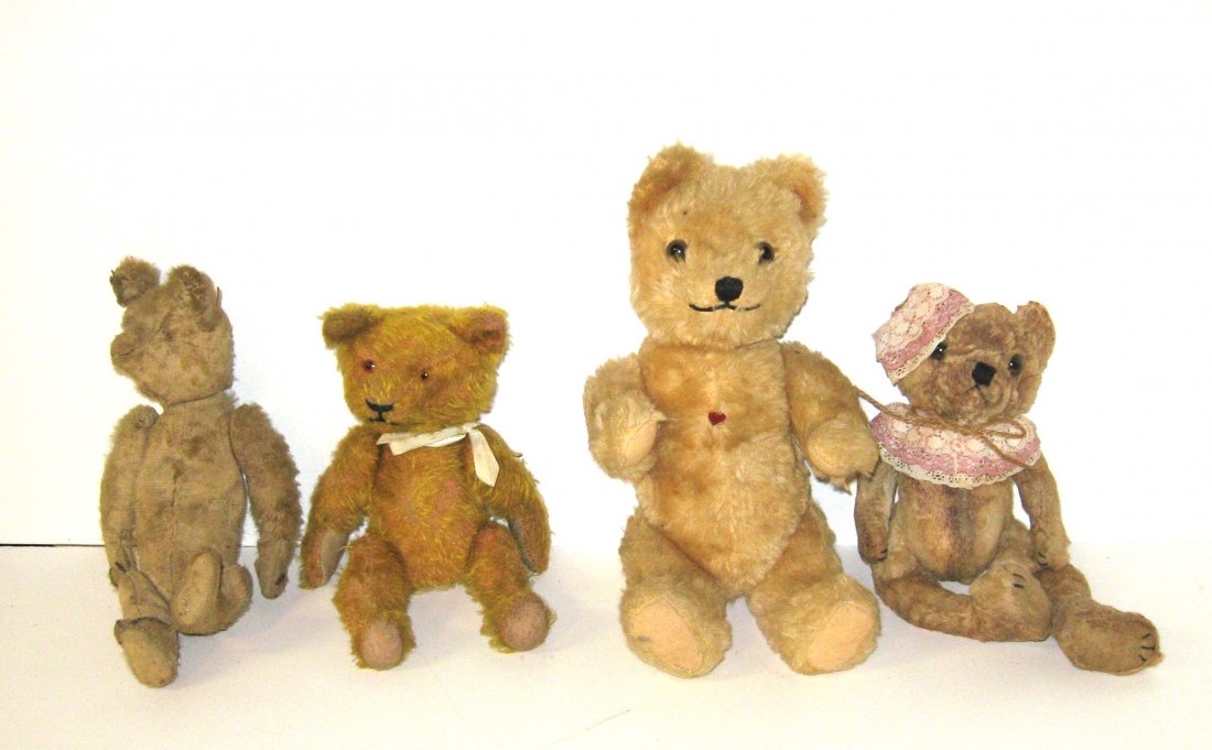 Group of four early teddy bears,: Each fully jointed with movable arms and legs, including a Berg bear with red metal heat, largest 12" ht.