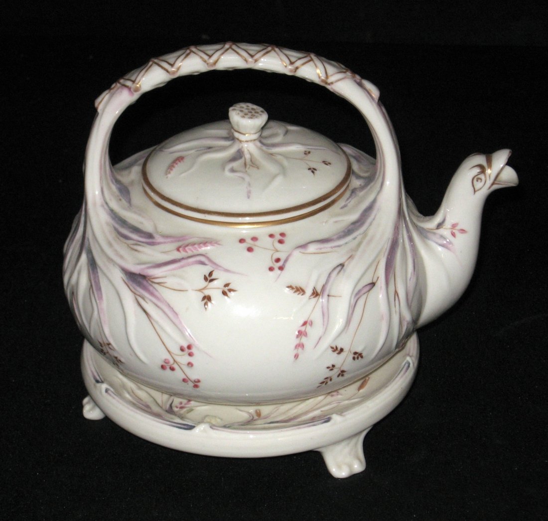 Belleek "Grass" Teapot and stand,: Kettle form teapot with red grass and bird spout set on a footed base, both with 1st black mark