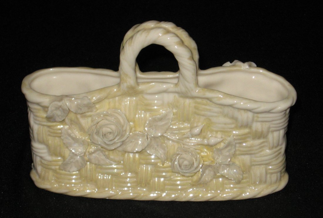Belleek "Straw" porcelain basket,: Loup handled close basket in the weave pattern adorned with applied daisies, 2nd black mark, 6' long.
