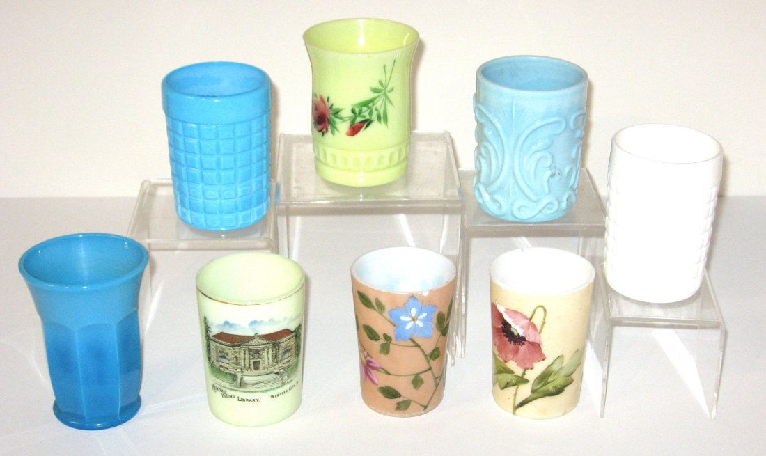 Group of 8 slag and opaline glass tumblers,: Including three blue slag glass, two flower enameled opaline, a yellow souvenir Kendall Young Library, Webster City Iowa and more, 4" ht.