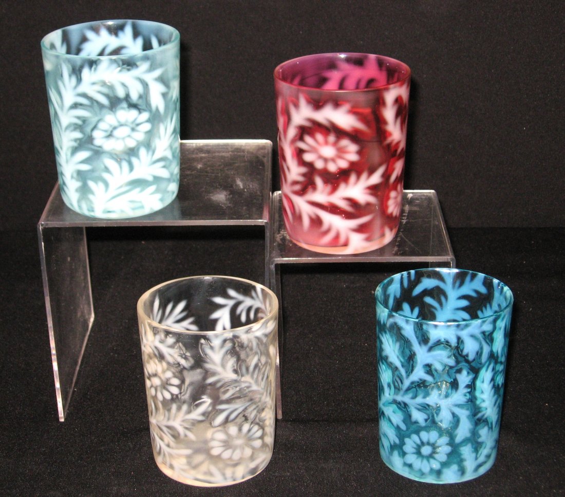 Four Daisy and Fern opalescent tumblers,: Including a ruby, a light and dark blue and a white each with the Daisy and Fern opalescent pattern, 3 3/4' ht.