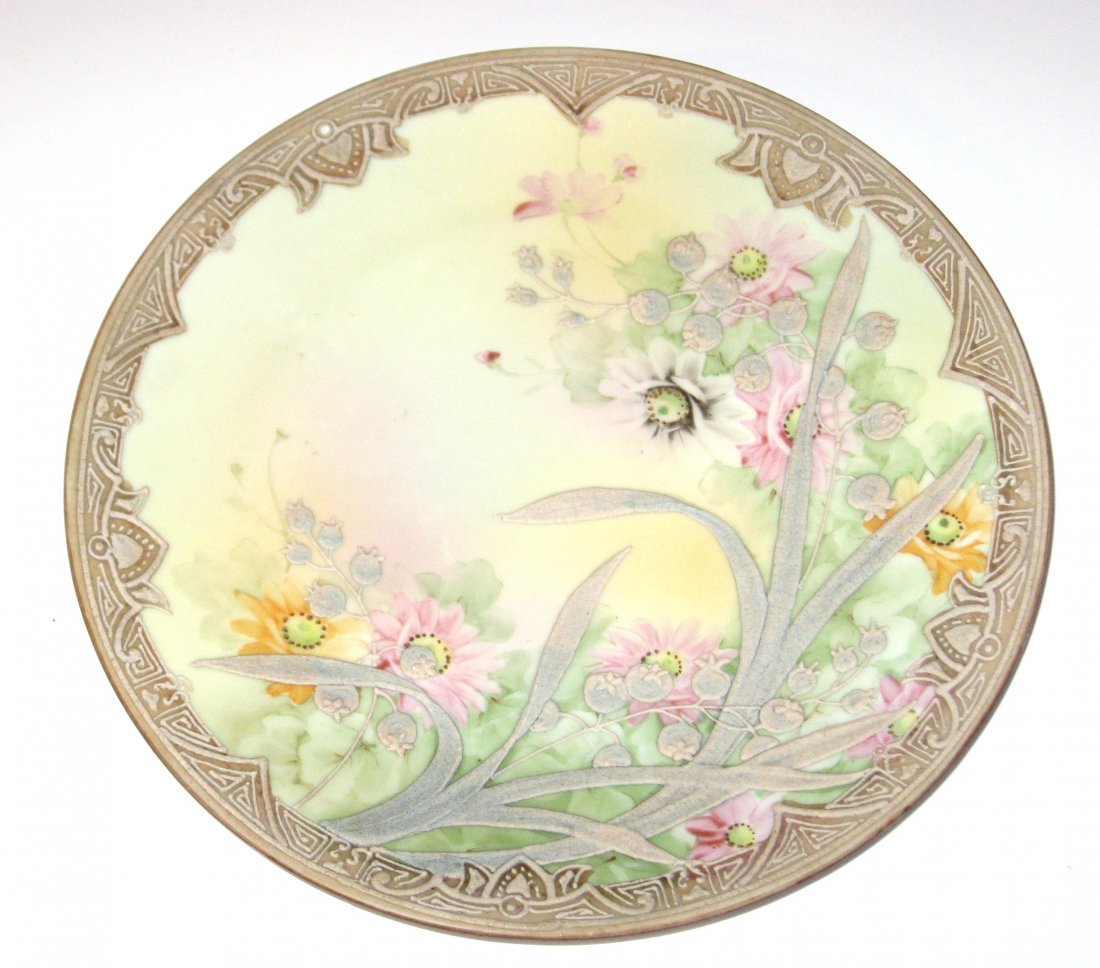 Nippon Moriage plate,: Spring flower plate with raised leafy seed pods and a stylized border, marked Nippon 8 3/4" wide.